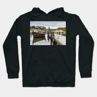 Peaceful landscape with lake and wooden boat Hoodie